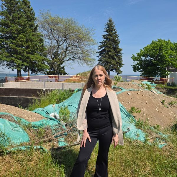 Christine Reio stands at the excavation site in June 2026